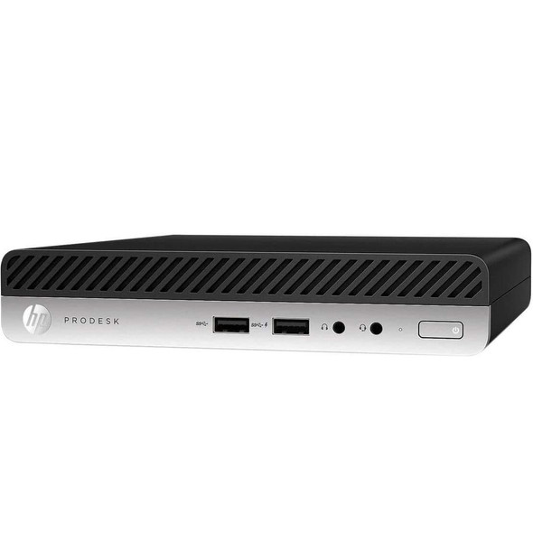 An angled front-view photograph of a compact HP ProDesk Mini PC set against a plain white background.

The device features a two-tone design:

The upper portion consists of a black ventilation grille with thick, diagonal slats.

The lower portion is a silver metallic panel containing several ports and buttons.

From left to right, the silver panel displays the circular HP logo, the word "PRODESK" in sans-serif type, two USB-A ports labeled with SuperSpeed icons, two 3.5mm audio jacks (one universal, one headphone), a small status light, and a rectangular power button on the far right.