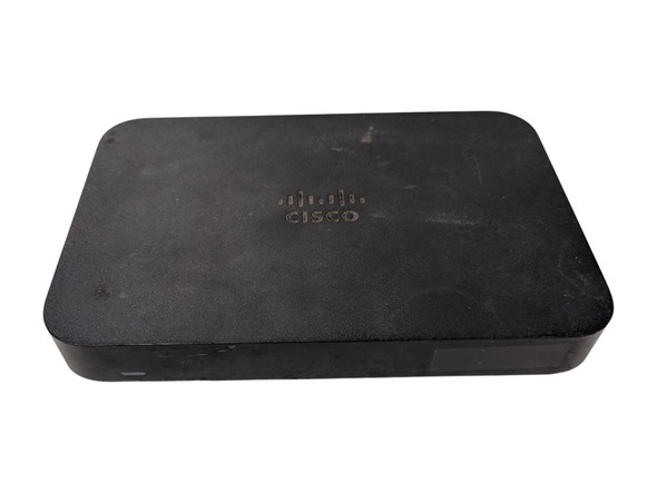 The image cisco-meraki-z3-vpn-firewall-top.jpg shows the top surface of a black Cisco Meraki Z3 teleworker gateway.

Alt Text Description
Design: The device features a minimalist, rectangular design with rounded corners and a textured matte black finish.

Branding: A glossy Cisco logo is centered on the top panel of the chassis.

Status Indicator: A small, thin LED status light is visible on the lower-left front edge of the device.

Form Factor: The image highlights the slim, low-profile desktop nature of the hardware.

Background: The unit is centered and isolated against a plain white background.
