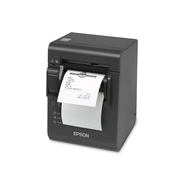 A high-angle, front-facing three-quarter view of a dark gray Epson TM-L90 Plus linerless thermal printer on a crisp white background. A white adhesive order ticket with a printed coffee shop logo and a drink order list feeds out from the front delivery slot. The printer features a prominent white Epson logo on the lower front, with a circular feed button and small labeled indicator lights for paper, error, and power aligned on the bottom left.