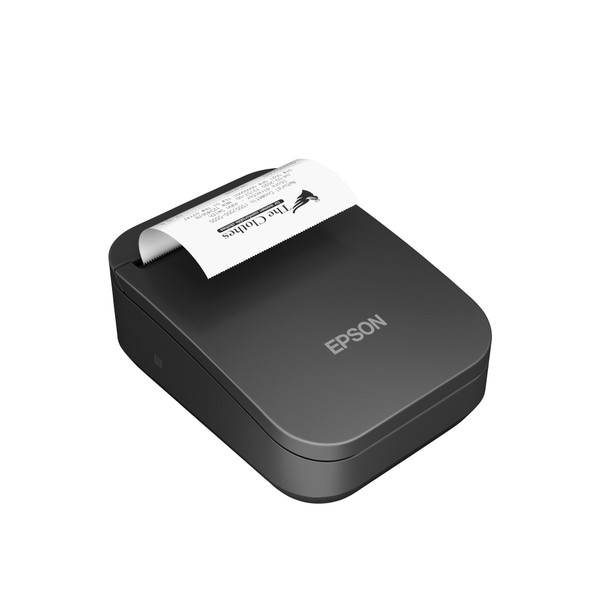 An isometric, high-angle studio shot of the black Epson Mobilink TM-P80II mobile wireless receipt printer (MPN: C31CK00001) in action, isolated against a pure white background. The device is shown feeding a printed, white thermal paper receipt from its top exit slot. The sample receipt features a printed store logo for "The Clothes" alongside standard transaction text, demonstrating the printer's layout capabilities. The silver EPSON logo is prominent on the lower cover, and the small, engraved NFC pairing icon is visible on the lower left side panel.