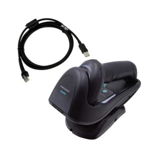 Product kit contents for the black Datalogic Gryphon GBT4500 wireless barcode scanner, shown from a high-angle perspective against a white background. The kit includes the handheld scanner resting horizontally in its matching charging base cradle, alongside a coiled black USB-to-RJ45 interface cable. The Datalogic Gryphon branding is visible on the front of the scanner head.
