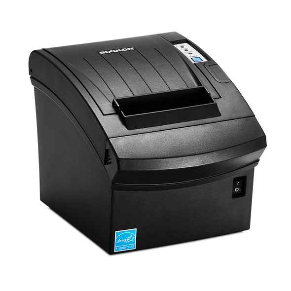 The file bixolon-srp-350plusiii-pos-thermal-receipt-printer-srp-350plusiiicosg-rdu-side.jpg presents the front and left side profile of a black BIXOLON POS thermal receipt printer, captured from a high three-quarter angle against a solid white background.

The image emphasizes the sloping, blocky silhouette of the matte black outer housing. The curved top lid includes subtle vertical ridges, a white centered BIXOLON logo, and a raised black paper output mouth at the front. To the right of the lid, the vertical interface strip features three status indicator lights—labeled Power, Error, and Paper—directly above a square blue Feed button. On the lower front face, a blue Energy Star logo sits on the left corner, and a small black, rectangular power switch is recessed on the right side.