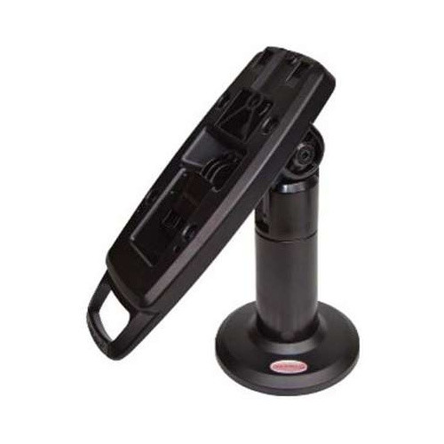 The file ens-flexipole-complete-counter-mount-quick-release-stand-ass30121-side2.jpg shows a three-quarter studio shot of a black ENS FlexiPole payment terminal counter stand, viewed from the opposite side perspective against a plain white background.

The black hardware features a vertical support pole mounted to a circular, flared desk flange, which has a small red and white oval sticker visible near its front edge. Affixed to the adjustable tilt hinge at the peak of the pole is a long, rectangular composite mounting plate tilted upward and back. The face of the mounting plate features open tracks, screw slots, and a molded D-shaped handle loop extending from its bottom edge, designed for quick manual positioning and secure hardware attachment.