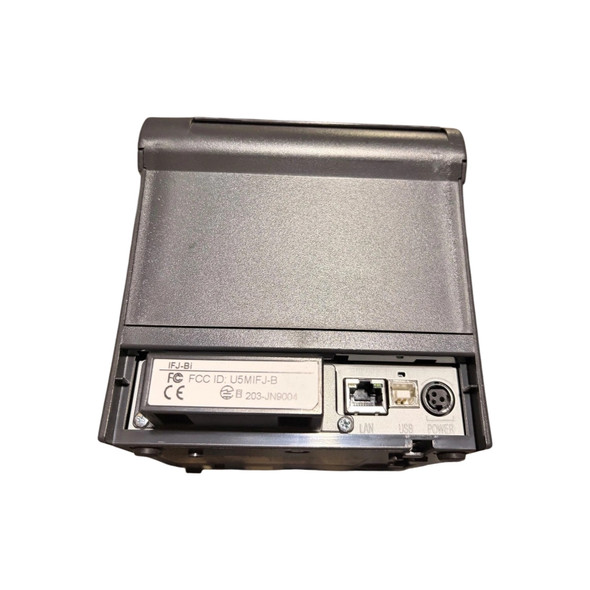 Back-facing view of the physical interface panel on a Bixolon thermal receipt printer. The interface module includes an IFJ-Bi communication block with FCC ID U5MIFJ-B, a LAN Ethernet port, a USB Type-B port, and a circular 3-pin power connection port labeled POWER.