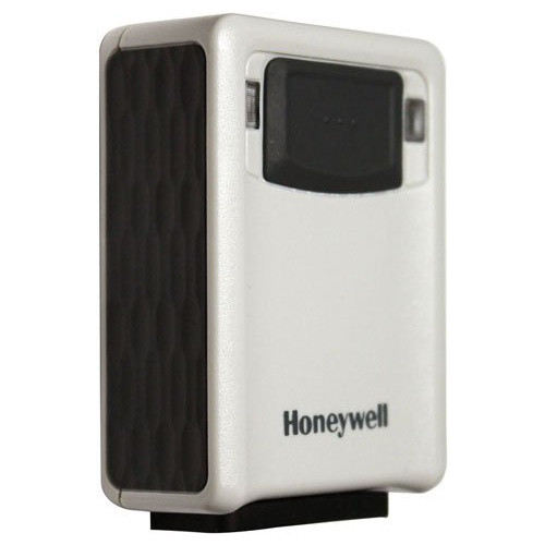 Here is a side view of the ivory Honeywell Vuquest 3320G compact scanner. The scanner is standing vertically on its integrated dark gray base. This perspective highlights the dark gray, textured side grip panel on the left. The front of the scanner is to the right, showing the dark central sensor area and the printed "Honeywell" logo below it. The product's main body is a clean, off-white (ivory) plastic.
