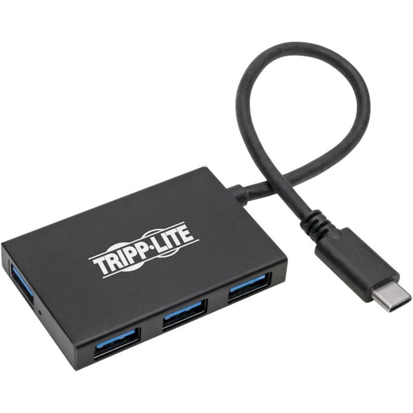 Top angled view of the black Tripp Lite portable hub, showcasing the full layout of the four blue expansion ports—one on the short end and three along the long side—complete with the looping built-in host connection wire.