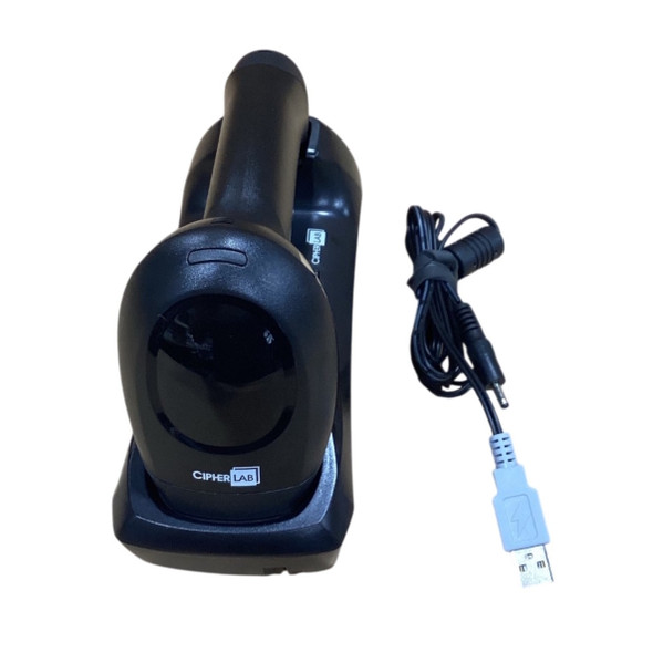 Complete CipherLab 2564MR wireless kit with the black 2D barcode scanner resting securely inside its matching vertical charging and communication cradle, positioned next to the included black USB host interface cable.