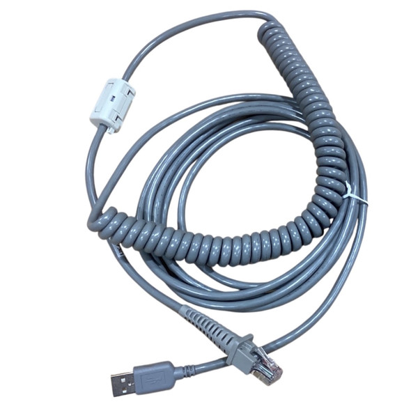 Overhead full view of the looped gray Datalogic 90A052066 barcode scanner cable, featuring the coiled midsection secured with a small white tie, an attached white snap-on ferrite bead, a USB Type-A connection, and an RJ45 connector interface.