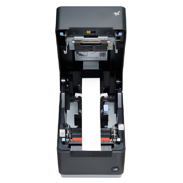 High-angle open view of a Star Micronics mC-Print3 printer with its top cover flipped back, revealing the internal paper bay loaded with a thermal paper roll feeding over the print head assembly and media guides.