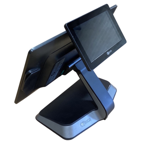 Profile view of a dual-screen NCR CX7 POS terminal setup, highlighting the main operator display screen and the integrated 7-inch rear customer-facing display attached to the mounting neck.