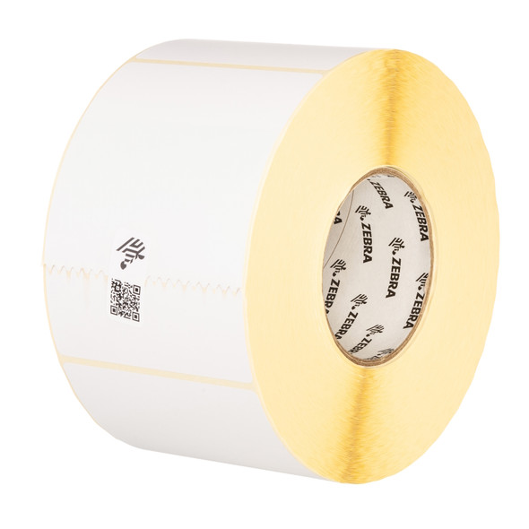 Close-up profile view of a roll of Zebra 4x6 direct thermal labels showing the perforated edges between white labels, a 3-inch core branded with the Zebra logo, and yellow label liner backing.