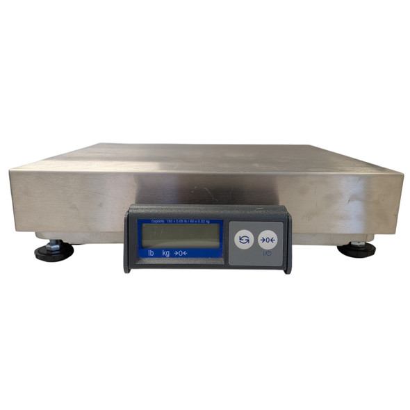 A straight-on front view of a Mettler Toledo PS60 scale isolated on a white background. The scale is configured with a square, brushed stainless steel top weighing platter sitting on adjustable black screw-in leveling legs. Centered on the front of the unit is a low-profile gray display controller with a long blue-bordered LCD window on the left displaying weight unit indicators (lb, kg, ->0<-) and two circular gray operation buttons on the right side.