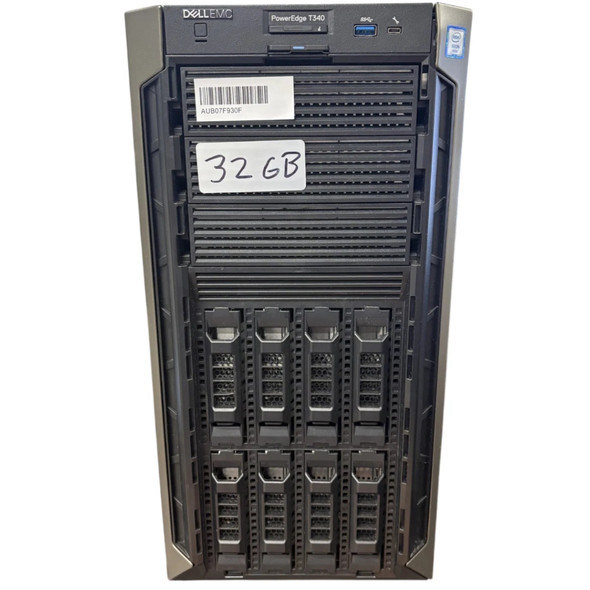 Front view of a Dell EMC PowerEdge T340 tower server against a plain white background. The top panel features the power button, a USB port, and an Intel Xeon sticker. The upper bays include a barcode sticker reading AUB07F930F and a handwritten label reading 32GB. The lower half features eight vertical 3.5-inch hot-swap drive bays.