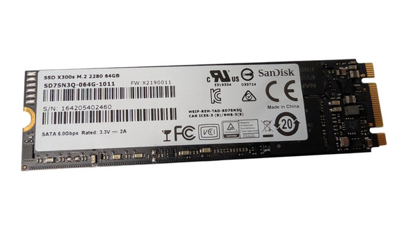 Front view of SanDisk X300s 64GB M.2 2280 SATA III SSD circuit board showing the main product label, part number SD7SN3Q-064G-1011, and B+M key connector.