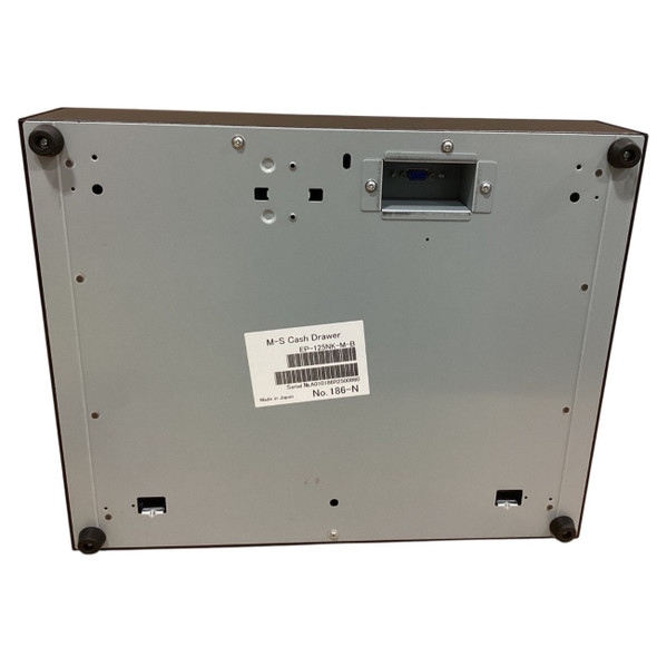 Bottom view of an M-S Cash Drawer EP-125NK-M-B featuring four rubber feet, a recessed bottom-exit interface port, and a product label displaying model EP-125NK-M-B and barcode details.