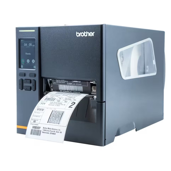 Angled front-right view of the Brother TJ-4021TN industrial label printer actively printing a shipping barcode label, featuring the side window for roll visibility.