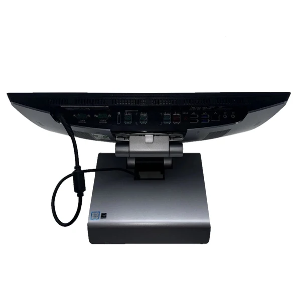 Rear underside view of the HP RP9 G1 Retail System Model 9015 all-in-one POS terminal mounted on its silver counter stand, showing the I/O connection ports and power cable against a white background