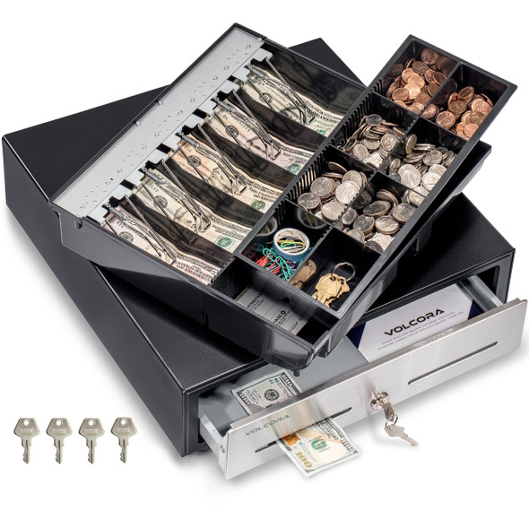 Angled overhead view of the open Volcora cash drawer showing the fully removable two-tier till loaded with cash and coins, sub-tray storage beneath, dual media slots, and 4 included keys.