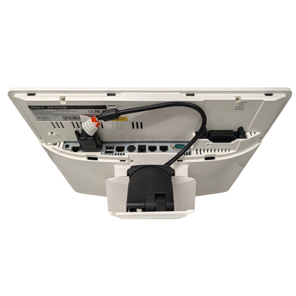 Rear perspective view of the Posbank Apexa G terminal displaying the I/O connection panel with plugged-in cables, audio jack, USB ports, LAN port, and the attached stand base