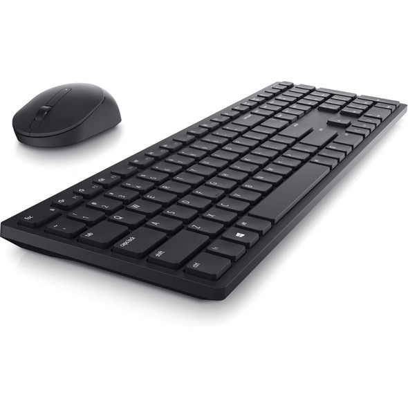 Low-angle profile view of the slim Dell Pro KM5221W keyboard showing low-profile chiclet keys with the wireless optical mouse positioned behind it.