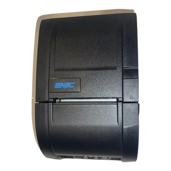 Top-down view of the closed black SNBC BTP-M300 impact kitchen printer highlighting the blue SNBC logo, receipt tear bar, and cover release lever.