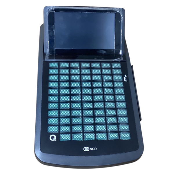 Front view of the NCR RealPOS enterprise tablet docked in its base station, showcasing the multi-key programmable grid keypad and tablet display.