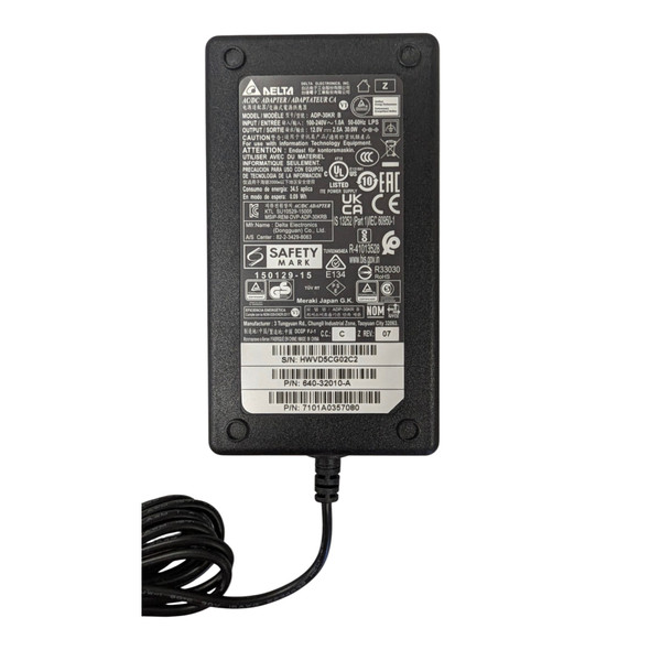 Close-up view of the technical specifications, safety certifications, and serial number barcode label on the back of the Delta ADP-30KR power supply brick.