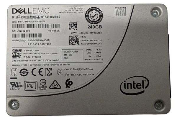 A top-down, close-up shot of a silver 2.5-inch Dell EMC enterprise-class SATA solid-state drive (SSD). The drive features an official "Enterprise Class" seal and an Intel logo in the bottom-right corner. A white label on the left side displays technical specifications, including the model number SSDSC2KG240G8R, a capacity of 240GB, and a SATA 6 Gbps interface. Various regulatory symbols, barcodes, and a QR code are visible across the label.