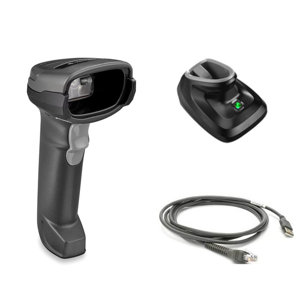 A product kit display isolated on a white background showing the components of a wireless barcode scanner system. On the left is a handheld 2D imager in twilight black with a light gray trigger and a recessed scan window. To the right is a matching black presentation charging cradle with a green LED power indicator illuminated. Below the cradle is a coiled dark gray shielded USB cable featuring a standard USB-A connector on one end and a modular RJ45-style connector on the other.