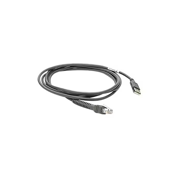An angled studio shot against a solid white background shows a dark gray, straight barcode scanner cable loosely coiled into an oval shape. In the foreground, the lower end of the cable terminates in a clear, modular RJ45-style connector with a black rubber strain relief boot. Extending outward to the right, the other end of the cable terminates in a standard USB-A male plug. A small white barcode or part label is wrapped around the cable jacket just before the USB connector interface.