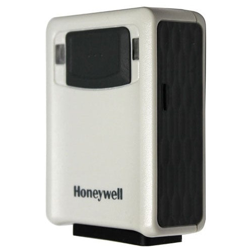 Three-quarter angled view of the ivory Honeywell Vuquest 3320g scanner body, highlighting the dark textured side panel, compact box-shaped design, and front-facing window with Honeywell branding.