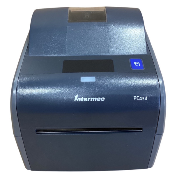 Front angle of the navy blue Honeywell PC43d direct thermal printer, highlighting the Intermec branding, the model name "PC43d," a blue feed button on the top right, a status LED indicator, and the front slot where labels exit.