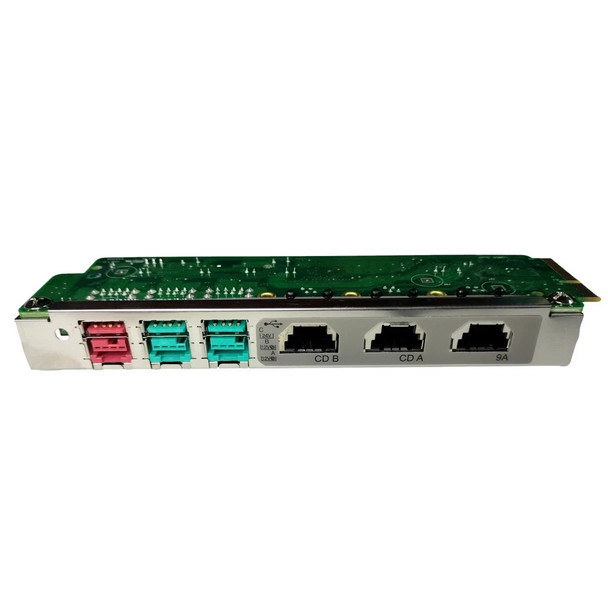 Front faceplate view of the IBM SurePort XG40 interface module (99Y1452) showing its distinct color-coded port matrix on a solid white background. The metal bracket houses three powered USB ports on the left (one pink, two teal) and three black modular RJ45 ports on the right labeled for serial communication lines including CD B, CD A, and 9A, built into a green printed circuit board.