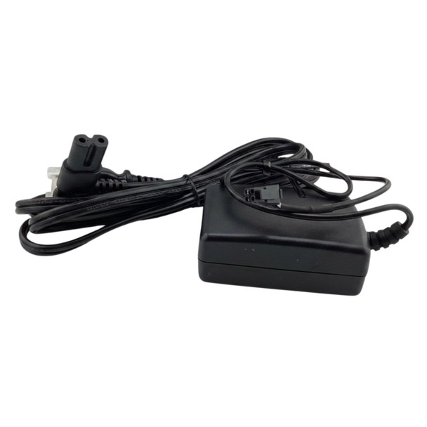 Black Kronos 8609002-001 AC power adapter brick shown with attached power cord and terminal connector wire against a white background.