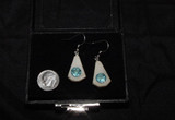 Alaskan Native crafted ivory with round Blue Topaz as center stones of this stunning earring set