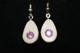 Alaskan Native crafted ivory with round cut natural bright purple pink tourmaline as center stones of this earring set.