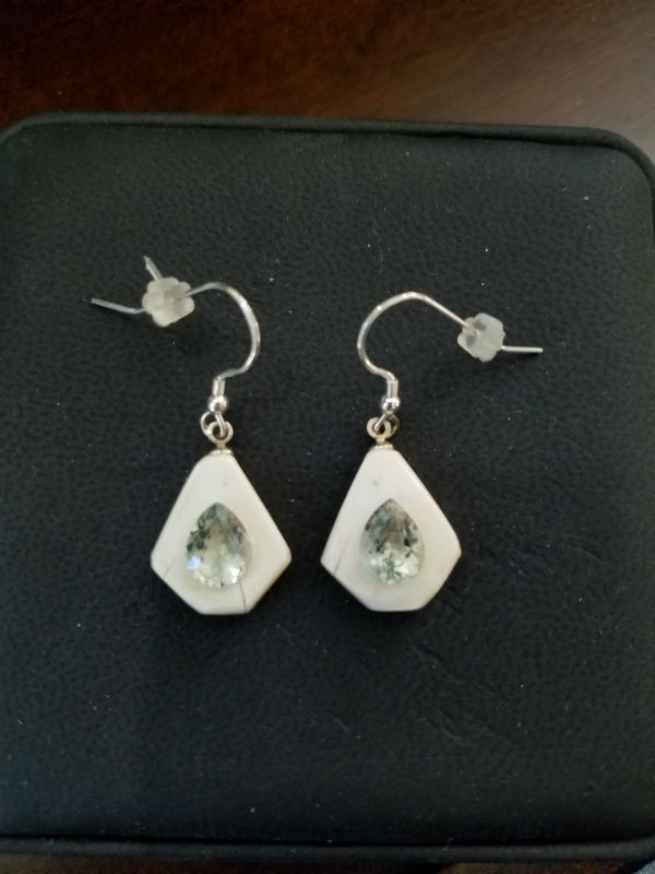 Alaskan Native crafted ivory with pear cut natural green Beryl as center stones of this stunning earring set