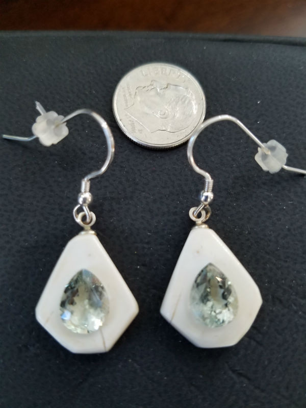 Alaskan Native crafted ivory with pear cut natural green Beryl as center stones of this stunning earring set