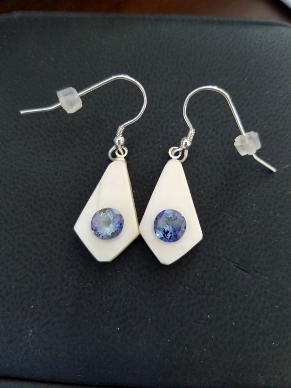 Alaskan Native crafted ivory with a sparkling round shaped natural Tanzanite as center stone of earring set