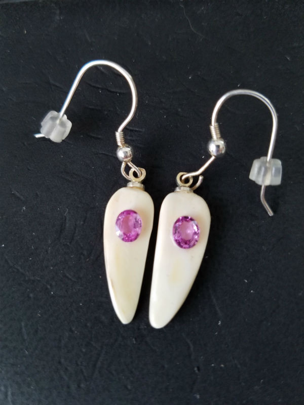 Unique, Alaskan Native crafted ivory with natural pink oval sapphire gems as the focal point in this petite earring set