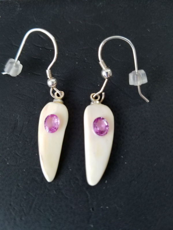 Unique, Alaskan Native crafted ivory with natural pink oval sapphire gems as the focal point in this petite earring set