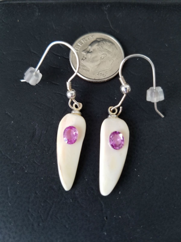 Unique, Alaskan Native crafted ivory with natural pink oval sapphire gems as the focal point in this petite earring set