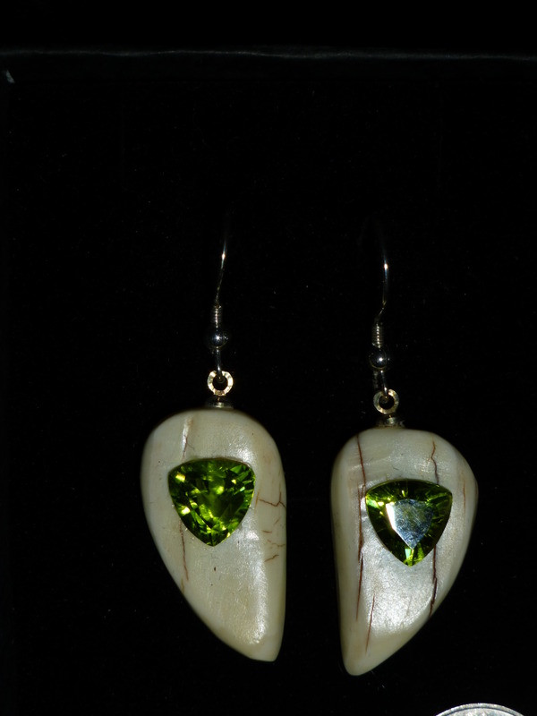 Alaskan Native crafted ivory with natural green Peridot Trillion Cut gems in a unique and stunning earring set