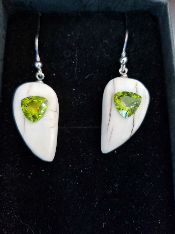 Alaskan Native crafted ivory with natural green Peridot Trillion Cut gems in a unique and stunning earring set