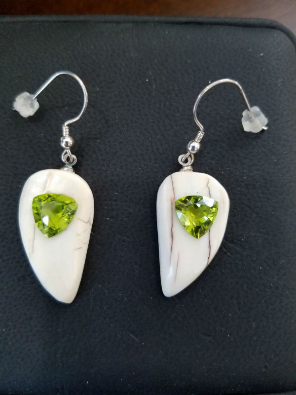 Alaskan Native crafted ivory with natural green Peridot Trillion Cut gems in a unique and stunning earring set