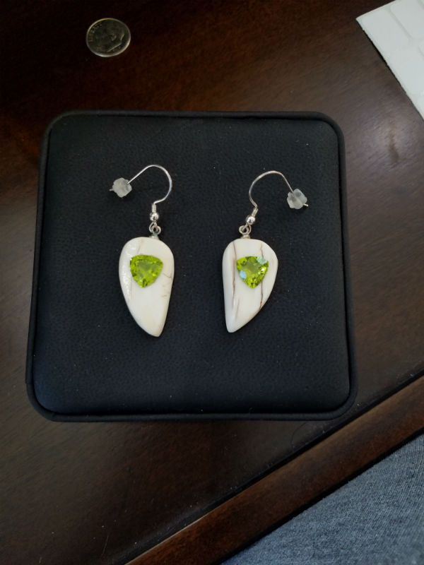 Alaskan Native crafted ivory with natural green Peridot Trillion Cut gems in a unique and stunning earring set