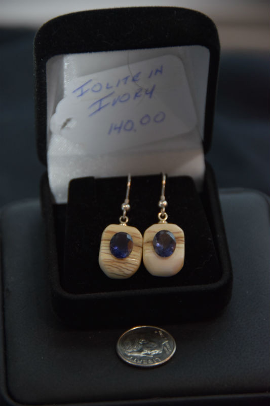 Alaskan Native crafted ivory with oval-shaped natural Iolite as center stone of this earring set