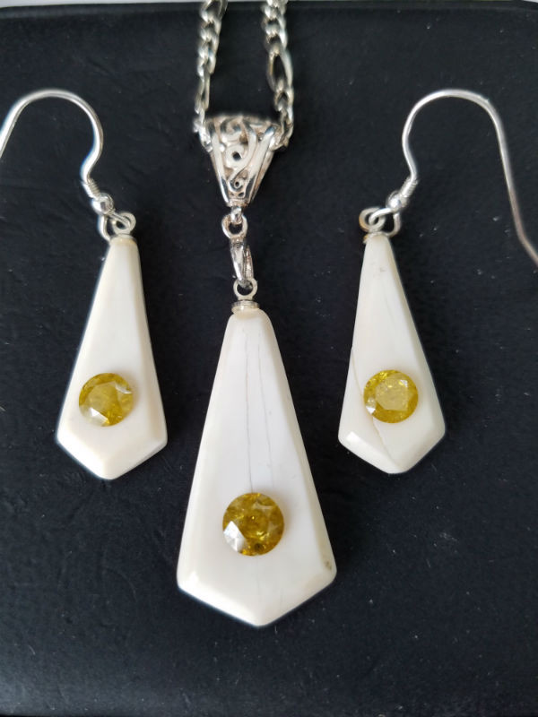 Alaskan Native crafted ivory and natural yellow diamond earring & pendant matching set.