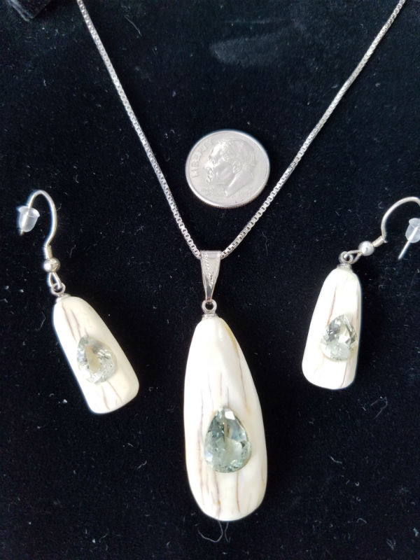 Alaskan Native crafted ivory with pear cut natural green Beryl as center stones of this stunning earring pendant set