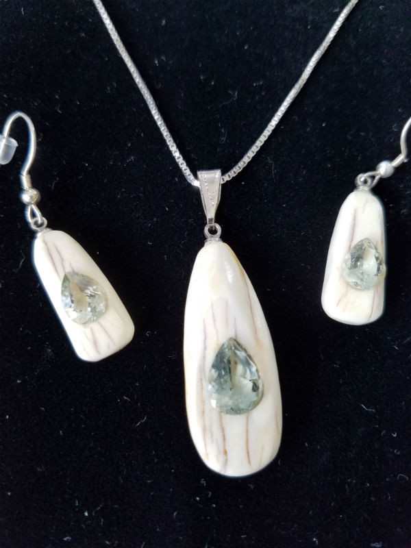 Alaskan Native crafted ivory with pear cut natural green Beryl as center stones of this stunning earring pendant set